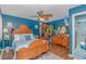 Cozy main bedroom with hardwood floors, ceiling fan, and a large bed, perfect for relaxation at 6001-N2 S Kings Hwy., Myrtle Beach, SC 29575