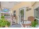 Relaxing porch area with outdoor seating and a ceiling fan at 6001-N2 S Kings Hwy., Myrtle Beach, SC 29575