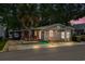 Charming home with a lush palm tree and pink shutters, offering a cozy coastal vibe at 6001-T3 S Kings Hwy., Myrtle Beach, SC 29575
