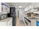 Efficient kitchen design with white cabinets, modern appliances, and ample counter space at 6001-T3 S Kings Hwy., Myrtle Beach, SC 29575