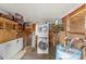 Functional laundry room features a stacked washer and dryer, open shelving, and ample storage space at 6001-T3 S Kings Hwy., Myrtle Beach, SC 29575