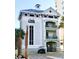 Beach Cabana building exterior at Barefoot Resort & Golf with golf cart parking and palm trees at 6015 Catalina Dr. # 732, North Myrtle Beach, SC 29582