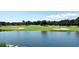 Scenic view of a golf course with a pond and sand traps, surrounded by lush greenery and trees at 6015 Catalina Dr. # 732, North Myrtle Beach, SC 29582