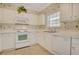 Bright kitchen with white appliances, ample counter space, and a window for natural light at 6015 Catalina Dr. # 732, North Myrtle Beach, SC 29582