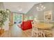 Bright living room with vaulted ceiling, showcasing stylish furniture and open floor plan to dining area at 6015 Catalina Dr. # 732, North Myrtle Beach, SC 29582