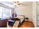 Bedroom with a bed, dresser, natural light, and hardwood flooring at 604 Heathrow Dr. # 1097, Myrtle Beach, SC 29579