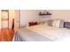 Bedroom featuring a stacked washer and dryer and red nightstand with lamp at 604 Heathrow Dr. # 1097, Myrtle Beach, SC 29579