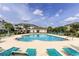 Resort-style pool with sun loungers and umbrellas, perfect for relaxing and enjoying the outdoors at 604 Heathrow Dr. # 1097, Myrtle Beach, SC 29579