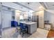 Bright kitchen with a large island, pendant lights, stainless steel appliances and custom cabinetry at 604 Heathrow Dr. # 1097, Myrtle Beach, SC 29579