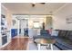 Inviting living room with open kitchen view, comfortable seating, and a warm ambiance at 604 Heathrow Dr. # 1097, Myrtle Beach, SC 29579