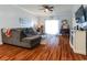Comfortable living room featuring a sectional sofa, wood floors, and a sliding glass door at 604 Heathrow Dr. # 1097, Myrtle Beach, SC 29579
