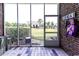 Screened porch featuring view of backyard and community green space at 604 Heathrow Dr. # 1097, Myrtle Beach, SC 29579