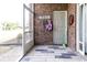 Enclosed porch with tiled floors and access to the backyard through a screened door at 604 Heathrow Dr. # 1097, Myrtle Beach, SC 29579