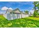 Back exterior view with a white fence enclosing a beautiful lawn at 631 Rycola Circle, Surfside Beach, SC 29575