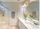 Bathroom featuring double sinks, vanity, shower-tub combo and bright lighting, spacious and convenient at 631 Rycola Circle, Surfside Beach, SC 29575