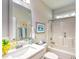 Bathroom featuring a white vanity, a framed mirror, and a shower/tub combo with white tiling at 631 Rycola Circle, Surfside Beach, SC 29575