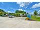 Community private pool parking area with blue skies, landscaping, and community signage at 631 Rycola Circle, Surfside Beach, SC 29575