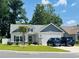 Charming single-story home featuring a two-car garage and manicured lawn at 631 Rycola Circle, Surfside Beach, SC 29575
