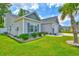 Charming single-Gathering home with well-manicured landscaping and a two-car garage at 631 Rycola Circle, Surfside Beach, SC 29575
