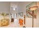 Inviting foyer with light wood flooring, console table, and decorative art at 631 Rycola Circle, Surfside Beach, SC 29575