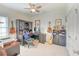 Comfortable office space features desk, computer, guitars, ceiling fan, and natural lighting at 631 Rycola Circle, Surfside Beach, SC 29575