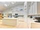 Bright, white kitchen with stainless steel appliances, ample cabinet space, large island and stylish backsplash at 631 Rycola Circle, Surfside Beach, SC 29575
