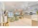 Open-concept living space with hardwood floors, comfortable seating, kitchen island, and stylish decor at 631 Rycola Circle, Surfside Beach, SC 29575