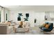 Bright living room with neutral tones, modern furniture, and view into kitchen space at 6344 Swainson Street Sw, Ocean Isle Beach, NC 28469