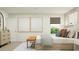 Spacious main bedroom with neutral walls, modern decor, and a sunny window with shade at 6344 Swainson Street Sw, Ocean Isle Beach, NC 28469