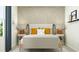 Inviting bedroom showcasing a comfortable bed, contemporary wallpaper, and decorative bedside lamps at 6362 Swainson Street Sw, Ocean Isle Beach, NC 28469
