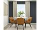 Dining area features a round table with seating for six in a modern decorated space at 6362 Swainson Street Sw, Ocean Isle Beach, NC 28469