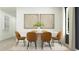 Dining room features a modern round table with seating for six beneath decorative artwork at 6362 Swainson Street Sw, Ocean Isle Beach, NC 28469