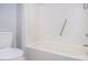Clean bathroom with white tile bathtub and chrome shower handle at 6702 Jefferson Pl. # C6, Myrtle Beach, SC 29572