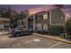 Exterior of condo showcasing the siding, windows with shutters, and landscaped front with personal parking at 6702 Jefferson Pl. # C6, Myrtle Beach, SC 29572