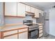 Updated kitchen featuring stainless steel appliances, white cabinets, and modern countertops with a stainless steel refrigerator at 6702 Jefferson Pl. # C6, Myrtle Beach, SC 29572