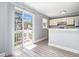 Bright kitchen area with sliding glass doors leading to an outdoor balcony space at 6702 Jefferson Pl. # C6, Myrtle Beach, SC 29572