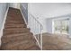 Carpeted stairs connecting multiple levels with natural light and neutral walls at 6702 Jefferson Pl. # C6, Myrtle Beach, SC 29572