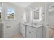 Bathroom with double sink vanity, and backlit mirror, offering a modern design at 800 Stone Pine Ct., Loris, SC 29569