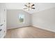 Bright, neutral bedroom with a ceiling fan and a large window at 800 Stone Pine Ct., Loris, SC 29569