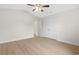 A clean bedroom with wood-look flooring, a ceiling fan, and white walls at 800 Stone Pine Ct., Loris, SC 29569