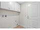 A functional laundry area with ample storage cabinets and hookups at 800 Stone Pine Ct., Loris, SC 29569