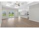 Open living space with hardwood floors, elegant tray ceilings and abundant natural light at 800 Stone Pine Ct., Loris, SC 29569