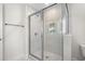 Glass-enclosed tiled shower with overhead showerhead at 800 Stone Pine Ct., Loris, SC 29569