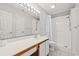 Clean bathroom featuring a large mirror, a white vanity, and a walk-in shower at 820 Fairway Dr. # 1502Hh, Longs, SC 29568
