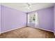 Cozy bedroom with neutral carpeting, light-colored walls, and a bright window at 820 Fairway Dr. # 1502Hh, Longs, SC 29568
