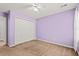 Bedroom with neutral carpet, light-colored walls, closet, and an adjacent door at 820 Fairway Dr. # 1502Hh, Longs, SC 29568
