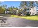 Well-maintained condos with green lawns and exterior stairs leading to upper units at 820 Fairway Dr. # 1502Hh, Longs, SC 29568