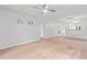 Open living room with ceiling fan and neutral carpet, ready for personalization at 820 Fairway Dr. # 1502Hh, Longs, SC 29568