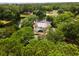 Beautiful aerial view of the home from above the trees, lush landscape, and waterfront property at 95 Sanderling Ave., Georgetown, SC 29440