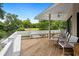 Relaxing back deck with a view of the pond and trees, providing an inviting outdoor space for entertaining at 95 Sanderling Ave., Georgetown, SC 29440